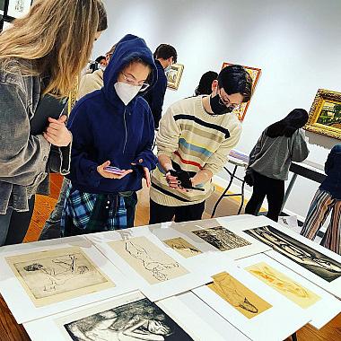 Biology students studying the anatomy of subjects in pieces of art from the Wright Museum of Art's collections.
